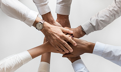 business-hands-joined-together-teamwork.jpg