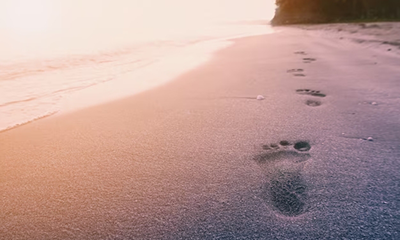 foot-print-beach-sunrise-sea-background-with-vintage-filter_7191-399.png